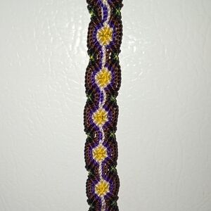 Elegant Braided Bracelet with Purple and Yellow Accents
